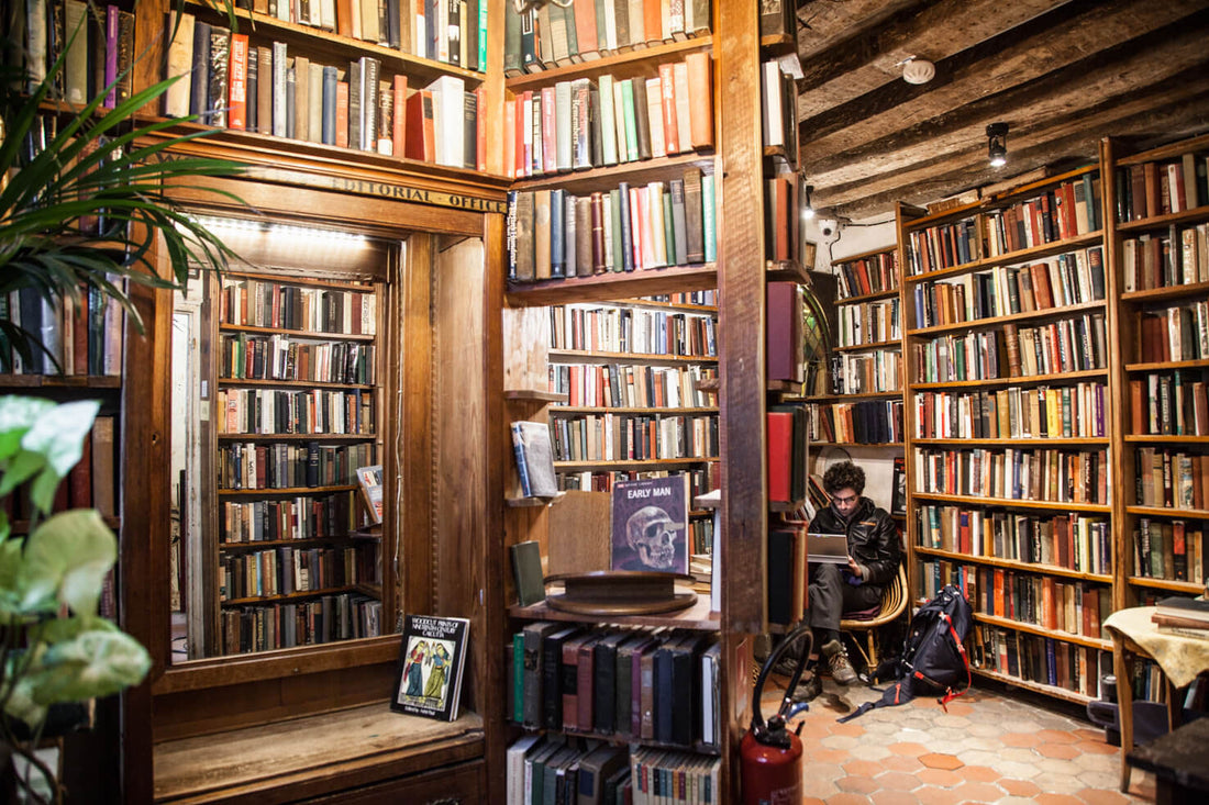 Charming exterior of a historic French bookshop with classic architecture and inviting entrance.